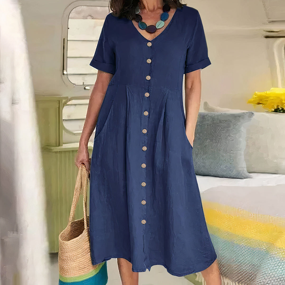 Ester Cotton Midi Dress" can be rephrased as "Ester Midi Dress Made from Cotton.