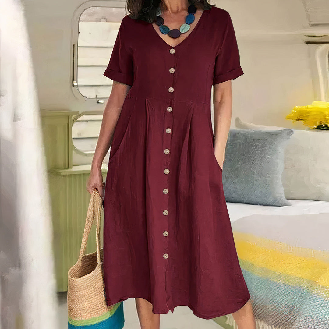 Ester Cotton Midi Dress" can be rephrased as "Ester Midi Dress Made from Cotton.